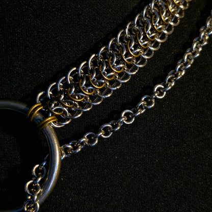 Close-up of a chain necklace on a black background