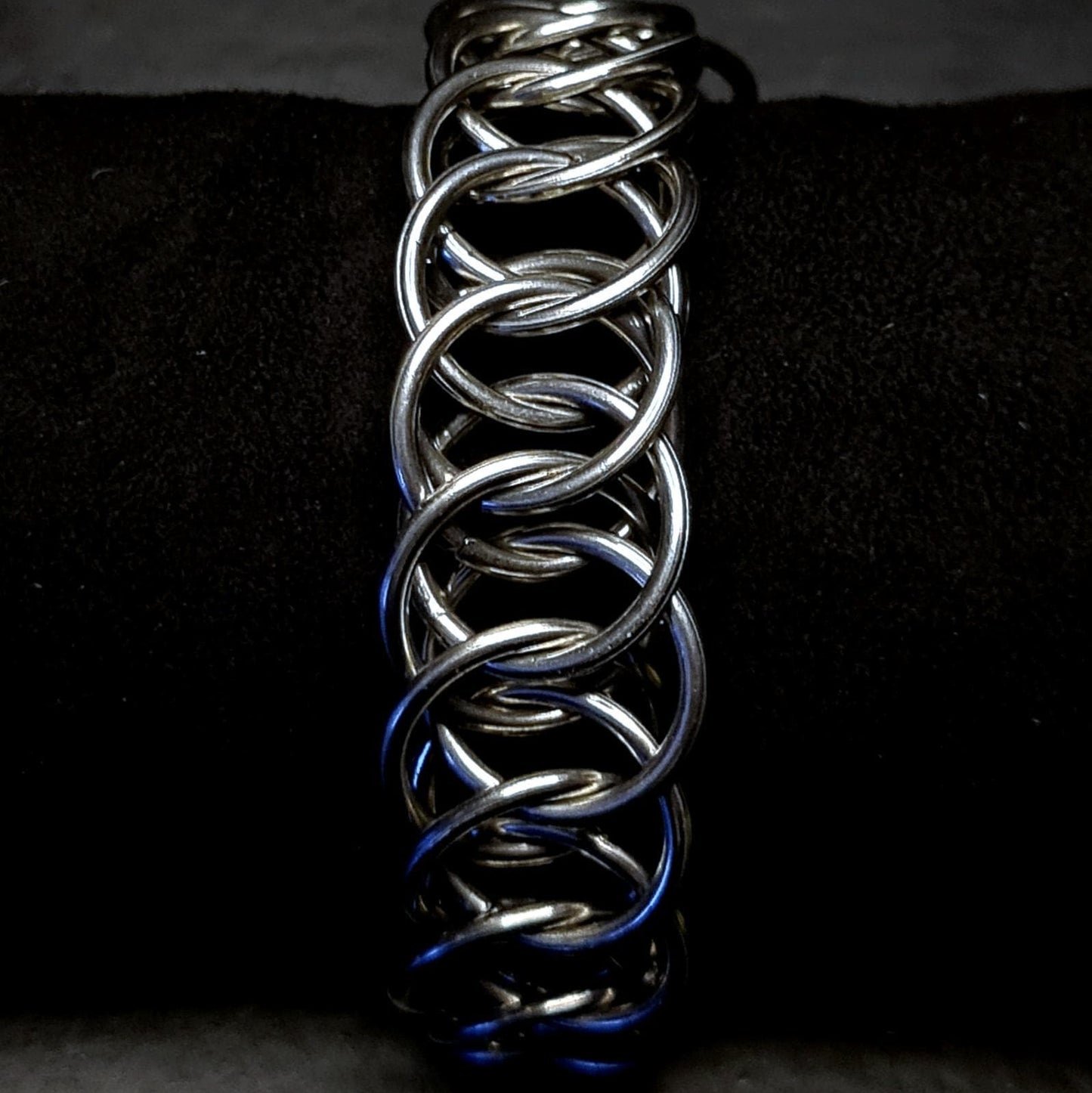 Metallic chain unisex bracelet on a dark background