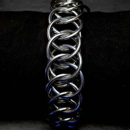 Metallic chain unisex bracelet on a dark background